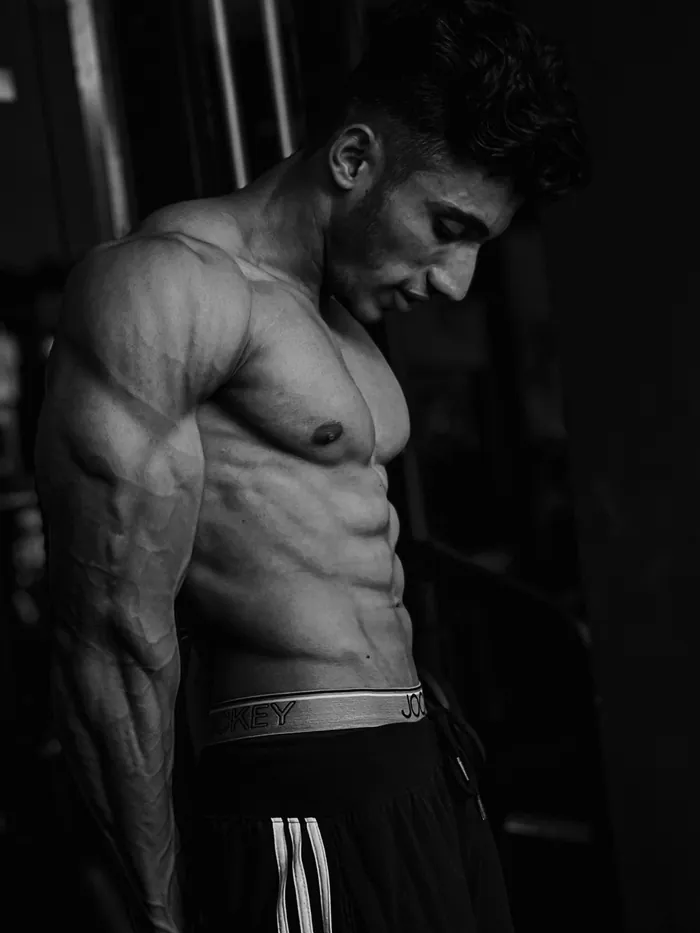 Client one after 120 days — visibly muscular chest, shoulders and arms
