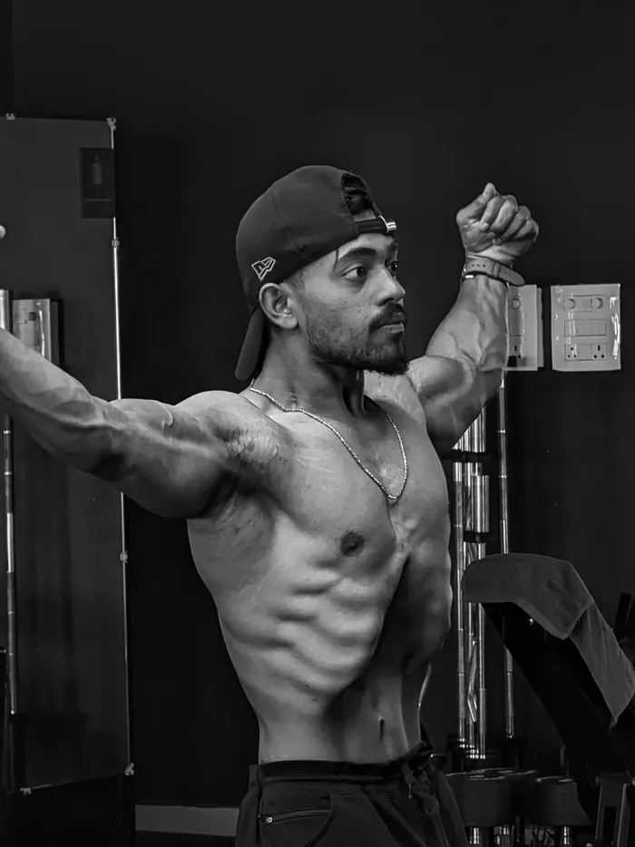 Client three after 120 days — shredded physique posing in the gym